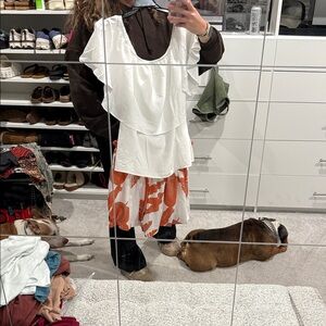 White Ruffle Top and Orange Patterned Shorts